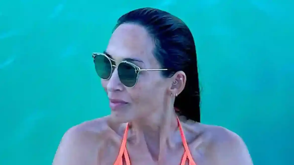 Myleene Klass turns heads in neon orange bikini as she relaxes on a catamaran during summer holiday in Greece