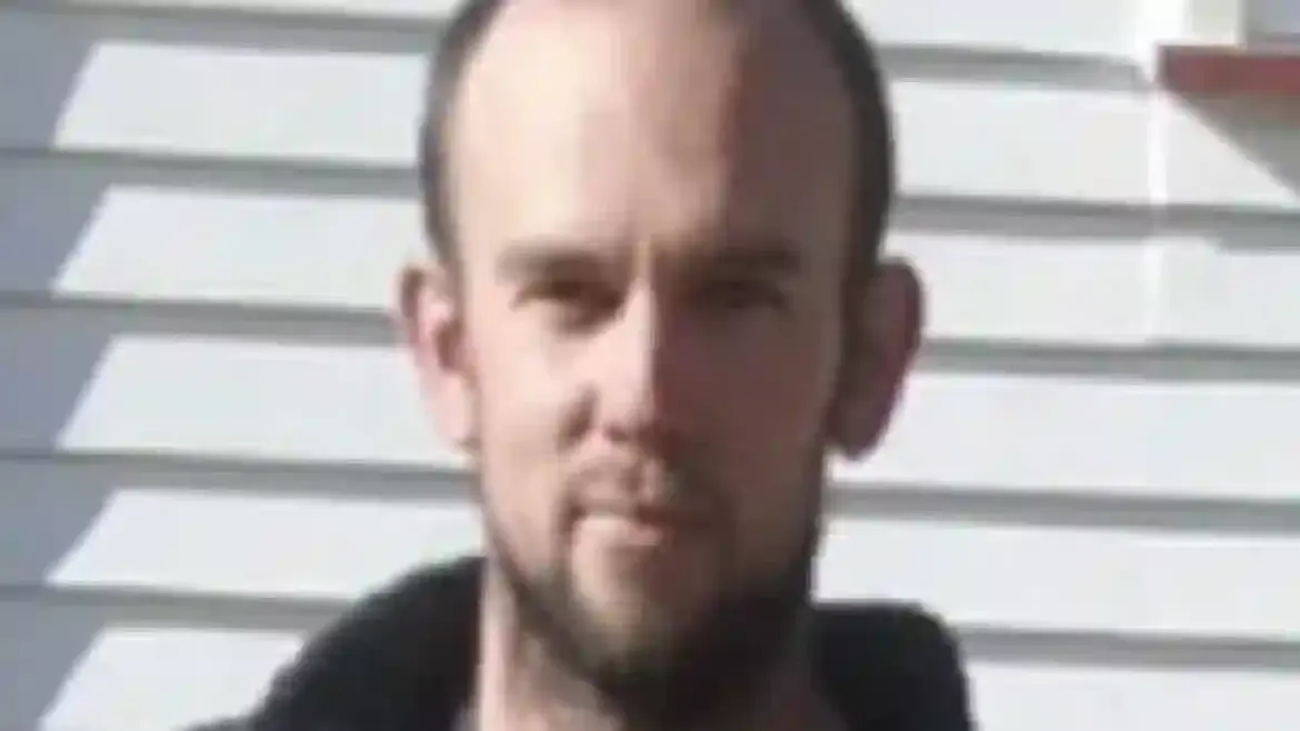 Tom Phillips is killed in shootout with police ending four-year manhunt while his three children are taken into care in New Zealand
