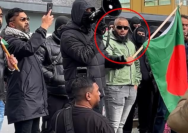 Businessman known as Big Fish urges peace and unity in Tower Hamlets after joining masked protesters during heated anti-UKIP demonstration 2 Tower Hamlets