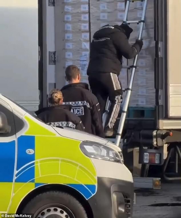 Eight migrants wearing designer tracksuits are found by police packed inside a lorry at M25 Waltham Abbey as chaos erupts at the busy truck stop 1 Eight migrants wearing designer tracksuits are found by police packed inside a lorry at M25 Waltham Abbey as chaos erupts at the busy truck stop