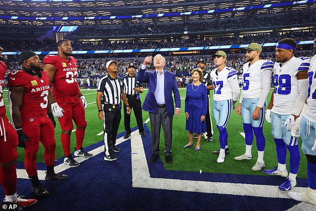 Former President George W Bush shocks onlookers with his hilarious reaction to giant Cardinals player Calais Campbell during Monday Night Football in Arlington