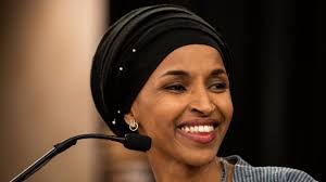 Representative Ilhan Omar reacts with alarm after hearing president say he does not want Somalis living in Minnesota