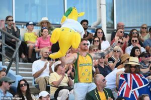 James Bray is escorted out of Rod Laver Arena at the Australian Open after being deemed too rowdy while cheering on Alex de Minaur