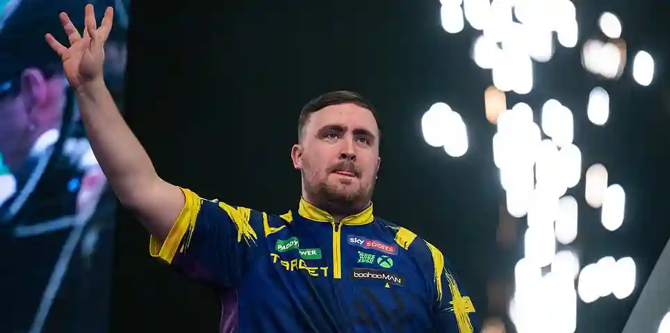 Luke Littler battles Ryan Searle for a place in the World Championship final at Alexandra Palace in London