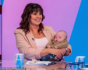 Coleen Nolan beams as she introduces grandson Cruz to viewers during Loose Women appearance in London while sharing hospital scare