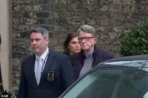 Peter Mandelson walks back into his London home after dramatic police arrest as top lawyers challenge claims he planned to leave the UK