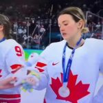 Team Canada women’s hockey players receive small mascot after losing intense overtime match to Team USA in Milan during 2026 Winter Olympics