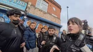 Tension Flares on Whitechapel Road as Officer Steps In