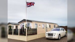 For many people, the word caravan still brings back memories of tight spaces, shared bathrooms, and late-night walks across chilly campsites. But that image is quickly becoming outdated. Today’s mobile homes are stepping into an entirely different class—think designer interiors, spacious layouts, and features you’d expect in a high-end property rather than something on wheels. Modern static caravans can stretch up to 60 feet wide, often dwarfing the size of a typical UK home. Inside, it’s not unusual to find freestanding bathtubs, vaulted ceilings, and carefully curated décor that rivals boutique hotels. A Royal Twist: Prince Andrew’s Unexpected Setup Perhaps the clearest sign of this shift comes from none other than Prince Andrew. The royal has reportedly embraced caravan living—at least temporarily—after placing a second-hand unit in the garden of Marsh Lodge on the Sandringham Estate. The property itself is still undergoing heavy renovation, leaving the caravan to serve a practical purpose. It’s believed to house his security team and provide a convenient base during site visits. Interestingly, the caravan—identified as a Willerby Meridian Lodge—was funded using money provided by King Charles III for living expenses. Even more surprising? Sources claim Andrew genuinely enjoys spending time there, suggesting a notable shift in lifestyle for the once high-profile royal. Not Just Royals: Celebrities Are Joining In Prince Andrew isn’t alone in warming to caravan life. TV presenter Josie Gibson has reportedly grown so fond of her mobile home setup that she wouldn’t mind living in one long-term. She moved into a caravan while her house underwent renovations—and ended up loving the simplicity and comfort it offers. This growing acceptance among public figures is helping reshape perceptions, turning caravans from a last-resort option into a lifestyle choice. The Rise of Affordable Luxury Homes Behind this transformation is a new generation of builders redefining what mobile homes can be. One standout is CS Vanguard Park Homes, a family-run business crafting high-end static homes at relatively accessible prices. Their homes start from around £48,000 and can climb to under £200,000—still far below traditional housing costs. Buyers are heavily involved in the design process, choosing layouts, finishes, and features to suit their tastes. From mirrored TVs to bespoke feature walls and air conditioning, these homes are anything but basic. Add in a 20-year waterproof warranty and modern appliances, and it’s easy to see why demand is growing. When Caravans Hit Millionaire Status At the extreme end of the market, caravans are even entering luxury real estate territory. A standout example emerged at Sandhills Holiday Park, where a holiday lodge was listed for a staggering £1.5 million. Despite offering under 1,000 square feet of space, the property included three bedrooms, sea views over Christchurch Harbour, and premium shared amenities like a heated pool and gym. While some critics dismissed it as overpriced, others pointed to its prime location as justification. Still, the listing sparked debate—especially given its limited lease and seasonal occupancy rules. A Palace on Wheels? Why Not Luxury caravans aren’t just about sleek modern design—they can also be playful and extravagant. In 2020, Parkdean Resorts unveiled a caravan styled after Buckingham Palace. Complete with chandeliers, gold-plated toilets, velvet thrones, and even royal-themed dog accessories, it offered guests a tongue-in-cheek taste of regal life—all for a surprisingly modest nightly rate. It proved that caravans can be both luxurious and fun, breaking every stereotype in the process. Impact and Consequences The growing popularity of high-end caravans is quietly reshaping the housing and holiday markets. For one, they offer a more affordable entry point into property ownership, especially as traditional home prices remain out of reach for many. They’re also influencing how people think about space and lifestyle—encouraging simpler, more flexible living arrangements. However, challenges remain, including planning permissions, land ownership issues, and concerns about long-term value compared to conventional homes. What’s Next? The future of caravans looks surprisingly bright. As designs become more sophisticated and demand increases, we may see mobile homes evolve into a mainstream housing solution rather than a niche alternative. With sustainability trends on the rise, there’s also potential for eco-friendly caravan developments—think solar-powered units and off-grid living options. Summary Caravans have undergone a dramatic transformation, shedding their outdated image in favor of luxury, flexibility, and affordability. From royal residents to everyday homeowners, more people are embracing the idea that living well doesn’t always require bricks and mortar. Bulleted Takeaways Modern caravans now rival traditional homes in design, comfort, and space Prince Andrew is reportedly using—and enjoying—a caravan during home renovations Celebrities like Josie Gibson are helping normalize caravan living Companies like CS Vanguard Park Homes offer customizable luxury homes at lower costs High-end caravans can reach eye-watering prices, such as the £1.5m lodge at Sandhills Holiday Park The trend signals a broader shift toward flexible, affordable, and stylish living solutions