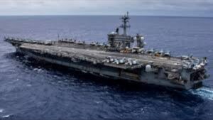 USS Abraham Lincoln Pulls Back From Iranian Coast Behind Oman's Mountains As Tensions Escalate In The Middle East