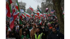 Iranian protesters celebrate Khamenei’s death while marching through London streets