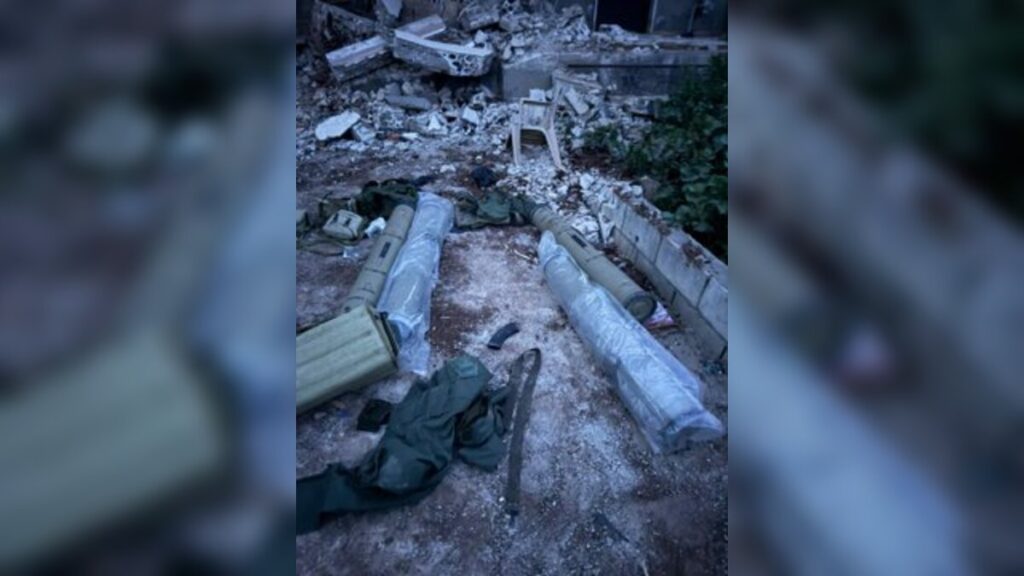 A launcher directed toward northern Israel, alongside anti-tank missiles and additional weapons used by Hezbollah