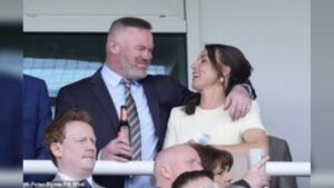 Coleen Rooney Stuns Crowd as She Embraces Wayne Rooney at Grand National Event in Aintree Racecourse Merseyside