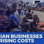 Something is shifting across Nigeria’s business landscape—and companies are feeling it in real time. While the economy hasn’t stalled, the pace of growth is clearly slowing as multiple pressures begin to stack up. From rising inflation to unreliable electricity and tougher access to credit, businesses are now operating in a far more demanding environment. The challenge isn’t just staying profitable—it’s staying afloat while planning for the future. Growth Is Still There, But It’s Losing Steam On paper, economic activity remains positive. But beneath the surface, momentum is fading. Many companies across manufacturing, retail, and services say the same thing: costs are rising faster than revenues. That imbalance is forcing difficult choices. Should businesses increase prices and risk losing customers? Or absorb the costs and shrink their margins? For many, neither option is ideal. Inflation Continues to Bite Hard At the center of it all is inflation. Prices of goods and services remain elevated, pushing up the cost of nearly everything businesses rely on—raw materials, transportation, and wages. For manufacturers, the pain is even sharper. Many depend on imported inputs, and with the naira under pressure, the cost of sourcing materials from abroad has surged. What used to be manageable expenses are now major financial burdens. Power Supply Problems Refuse to Go Away If inflation is one headache, energy is another. Despite ongoing reforms, electricity supply across Nigeria remains inconsistent. That means businesses—large and small—are forced to generate their own power using diesel or petrol generators. But here’s the catch: fuel prices have risen significantly. So now, companies are spending far more just to keep the lights on. Energy is no longer a background expense—it’s becoming one of the biggest cost drivers. For many firms, money that should go into hiring, expansion, or upgrading equipment is instead being spent on fuel. Over time, that trade-off weakens productivity and slows growth. Borrowing Money Is Getting Harder Access to finance is also tightening. Interest rates are climbing, and banks are becoming more cautious about who they lend to. Small and medium-sized businesses are feeling the squeeze the most. These businesses often rely on short-term loans to keep operations running. Now, with stricter lending conditions, many are struggling to maintain inventory or fund day-to-day activities. Even large corporations aren’t immune. Higher borrowing costs are starting to eat into profits and delay investment plans. Businesses Are Being Forced Into Survival Mode Put it all together—inflation, energy costs, and limited financing—and you get shrinking profit margins across the board. Companies are becoming more cautious. Expansion plans are being delayed. Hiring is slowing. The focus has shifted from aggressive growth to efficiency and survival. Pricing has also become tricky. Passing costs to consumers sounds simple, but in reality, weak purchasing power limits how much businesses can increase prices without losing customers. Changing Consumer Behavior Adds Another Layer Consumers themselves are adjusting. With rising living costs, people are prioritizing essentials and cutting back on non-urgent spending. This shift is especially visible in retail and consumer goods. Businesses are responding by offering smaller, more affordable product sizes or budget-friendly alternatives just to keep sales moving. Manufacturing Sector Feels the Strain The manufacturing sector is also under pressure. Rising production costs, logistics challenges, and exchange rate fluctuations are slowing output. Some factories are not running at full capacity anymore—not because they can’t produce, but because demand and costs don’t justify it. Not All Sectors Are Struggling Equally Despite the tough environment, some businesses are holding up better than others. Companies with strong pricing power or efficient operations are managing to stay ahead. Those with access to stable electricity or alternative energy solutions also have an edge. Export-focused businesses are another bright spot. Earning in foreign currency gives them some protection against the weakening naira and rising domestic costs. Impact and Consequences The current situation is gradually reshaping Nigeria’s economic landscape. First, profit margins are shrinking across industries, which could lead to reduced investment and slower job creation. Over time, this may affect employment levels and overall economic growth. Second, the shift toward survival strategies means fewer innovations and expansions. Businesses are focusing on staying operational rather than taking risks or exploring new markets. Third, consumers may continue to face higher prices and fewer choices as companies adjust offerings to match tighter budgets. What’s Next? Much depends on policy direction in the coming months. Improving electricity supply would significantly reduce operating costs for businesses. Stabilizing the naira could ease pressure on import-dependent sectors. And making credit more accessible would help companies regain momentum. If these structural issues are addressed, businesses could regain confidence and begin to expand again. If not, the current cautious trend may persist. Summary Nigeria’s business environment is entering a tougher phase. Rising inflation, unreliable power, and tighter financing conditions are squeezing companies from all sides. While the economy is still growing, that growth is slowing as businesses adjust to a new reality—one where efficiency matters more than expansion, and survival often comes before ambition. Bulleted Takeaways Rising inflation is increasing costs of raw materials, logistics, and labour Weak naira is making imports more expensive for manufacturers Unreliable electricity is forcing businesses to rely on costly generators Energy has become a major expense for both small and large firms Access to credit is tightening due to higher interest rates and cautious lending Profit margins are shrinking, pushing companies into survival mode Consumers are shifting to essential spending and cheaper alternatives Manufacturing output is slowing due to rising costs and weaker demand Some sectors remain resilient, especially export-oriented businesses Policy reforms in power, currency stability, and financing are key to recovery