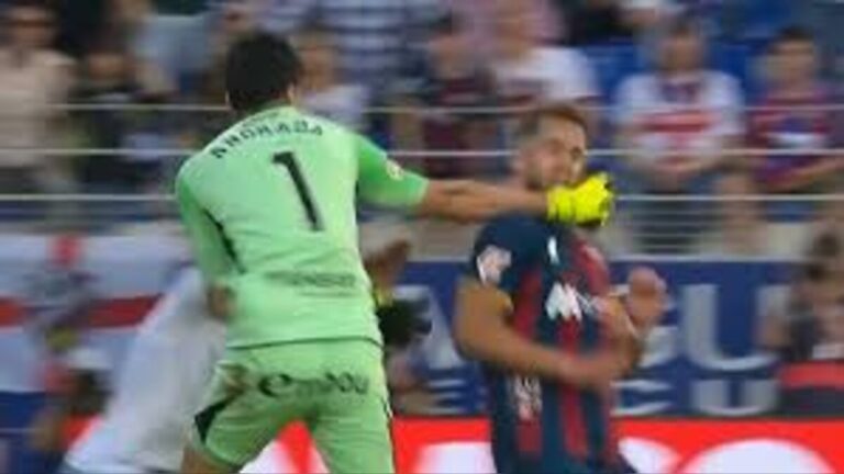 Real Zaragoza goalkeeper Esteban Andrada punches Huesca defender Jorge Pulido during violent Aragon derby clash in Spain as match descends into chaos