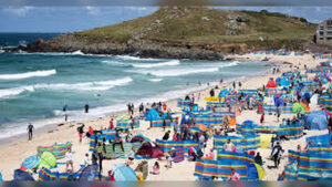Holidaymakers Descend on Cornwall as Local Resident Criticizes Falmouth and Padstow While Tourists Overrun Beaches and Streets in Peak Summer Season Across Cornwall