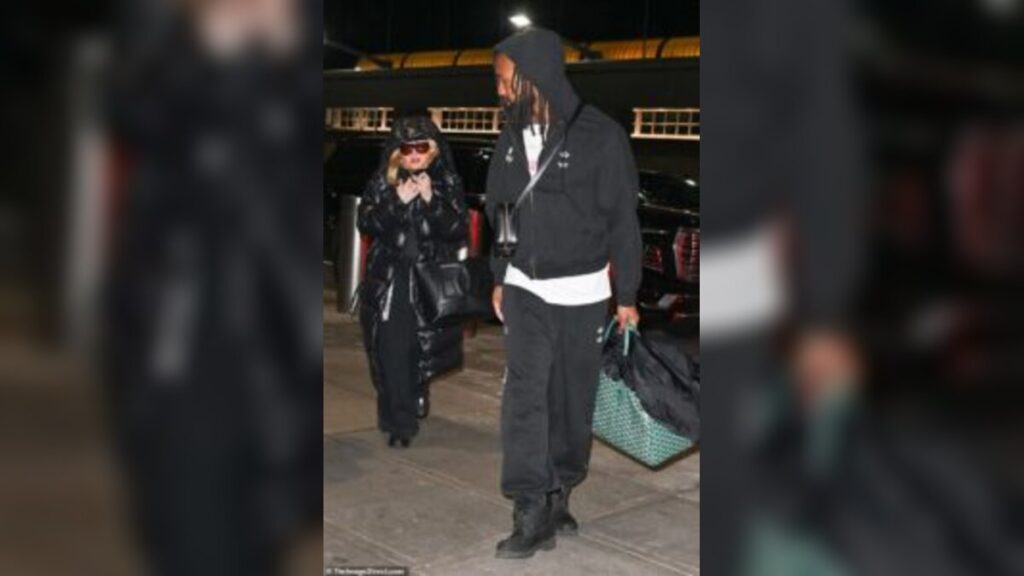 Madonna Turns Heads at JFK as She Travels With Akeem Morris After His Birthday Celebration in New York City