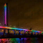Montreal Illuminates Samuel De Champlain Bridge with Rainbow Lights to Celebrate LGBTQ Awareness Day Across Quebec Canada