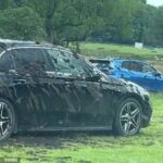 Tourists ignore warning signs as farmer covers luxury vehicles in muck at Rydal Water beauty spot Cumbria England