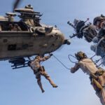 U.S. Marines from the 31st Marine Expeditionary Unit rappel out of an MH-60S Sea Hawk