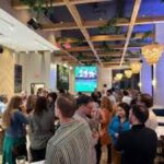 Young Catholics flood Emmaus Happy Hour revive faith community Washington DC