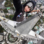 Death Wish or Viral Fame? Mystery Climber Risks Everything on Top of Moscow Landmark