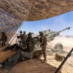 U.S. Army Paratroopers fire a 155mm round from an M777 howitzer during a field artillery exercise in the Middle East