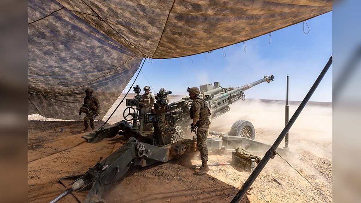 U.S. Army Paratroopers fire a 155mm round from an M777 howitzer during a field artillery exercise in the Middle East